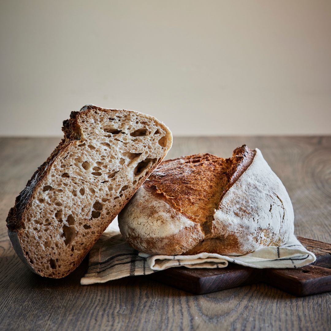 Premium Photo  Rye sourdough on flour sourdough in a container on a wooden  table. fermentation. the hand holds a wooden spatula, the readiness of the  sourdough is checked.